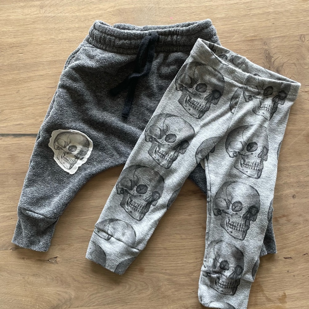 2 pair nununu pants: one leggings, one joggers. Skeleton print. 6-12mo.